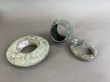 two rings that are sitting next to each other on a table