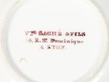 a white plate with a red inscription on it