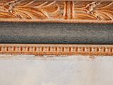 a close up of a picture of a painting on the wall