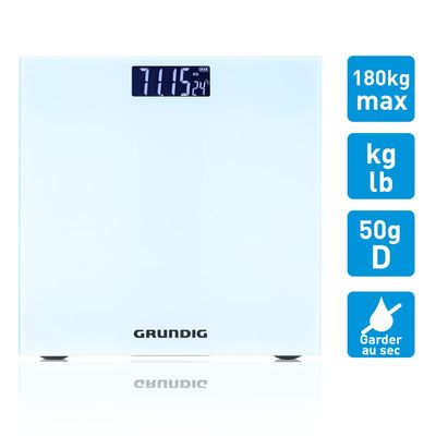 a white bathroom scale with a clock on top of it