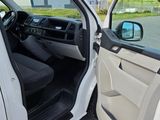 a white truck with the door open and the driver ' s seat down