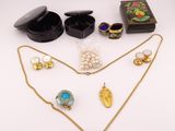 a collection of jewellery including a necklace, ring, earrings and a box
