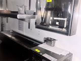 an image of a commercial kitchen with a lot of counter space