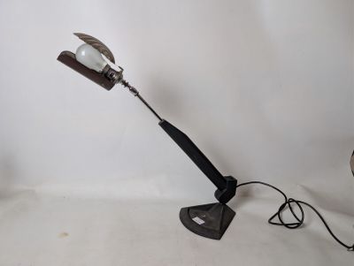 a lamp that is sitting on a table next to a fan