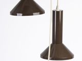 three brown lamps hanging from a white ceiling in a room