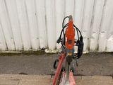 a small machine that is sitting on the side of the road