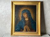 une image représentant un tableau où l'on voit une femme tenant un chapelet