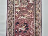 a red rug with a picture of animals and birds on it