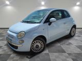 a picture of a small blue car parked in a garage