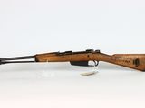 a rifle with a wooden barrel and a wooden handle