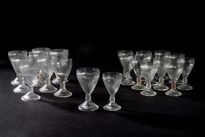 a lot of empty wine glasses on the table