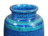 a blue vase with a pattern on it on a white background