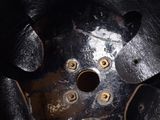a close up of a metal object with holes in it