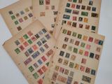 several old stamps are stacked on top of each other on a table