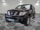 a picture of a black nissan truck parked in a garage