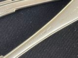 three spoons that are sitting on a table