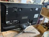 an image of a monitor on a table in a room