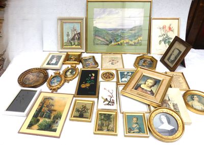 a lot of framed pictures and pictures on a table