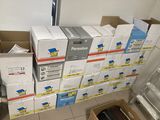 many boxes stacked on top of each other on the floor