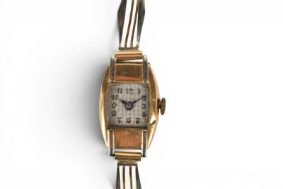 an image of a woman ' s wrist watch on a white surface