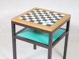 a small table with a chess board on top of it