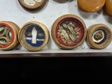 a lot of different types of wooden knobs in a box