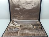 a black case with silverware in it on a table