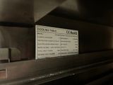 a sign on the side of a machine that says cooking table roks