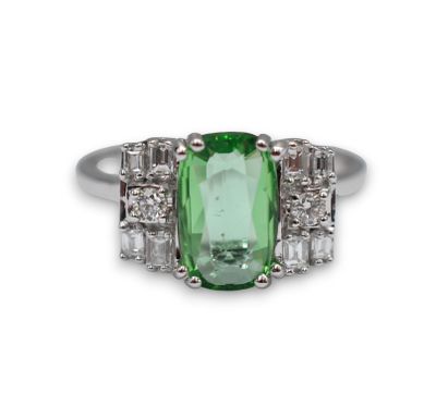 an oval green tourmaline and diamond ring