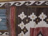 a close up of a rug with a pattern on it