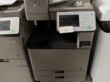 many different printers and scanners sitting on the floor