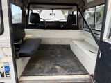 a white van with a black seat in the back of it