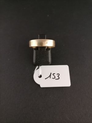 a close up of a gold ring with a tag on it