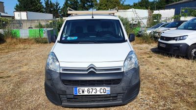 a white van that is parked in the grass