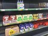 many different types of sodas on the shelves in the store