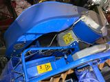 a blue machine that is sitting on top of a table