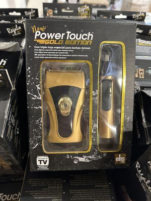 une boîte sur laquelle figure un rasoir électrique noir et doré