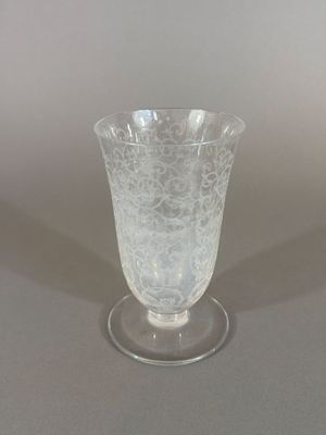 a glass vase that is sitting on a table
