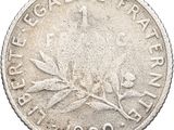 a close up of a coin on a white background