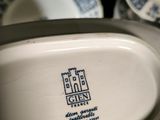 a white plate with a blue and white design on it