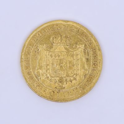 l'image d'une pièce d'or sur laquelle figurent des armoiries