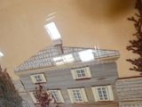 a picture of a model of a house in a glass case