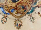 a painting of a coat of arms with a lion on it