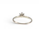an image of a ring with a single diamond on it