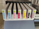 a lot of different colors of ink on a printer