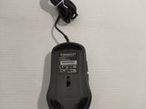 a black mouse with a cord attached to it