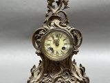 a small clock that is sitting on a table