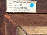 a blue sticker on the side of a wooden building