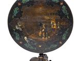 an image of a black and gold painted table on a tripod