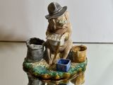 a figurine of a dog sitting on a table